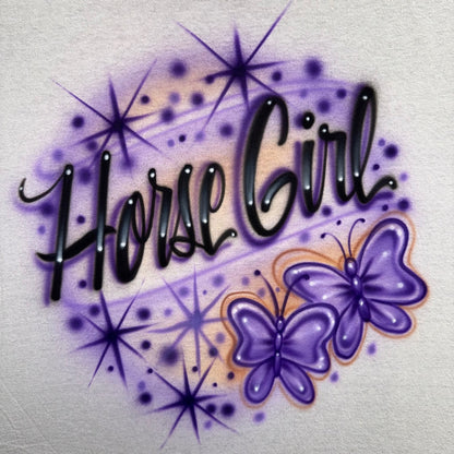 Horse Girl airbrushed shirt featuring custom script text, purple butterflies, sparkles, and hand-painted airbrush details
