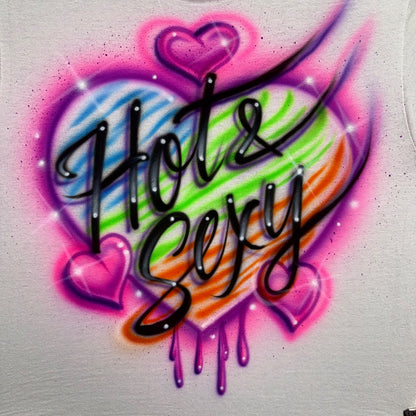 Airbrushed Hot & Sexy text over a rainbow striped heart with neon pink accents and drippy details.