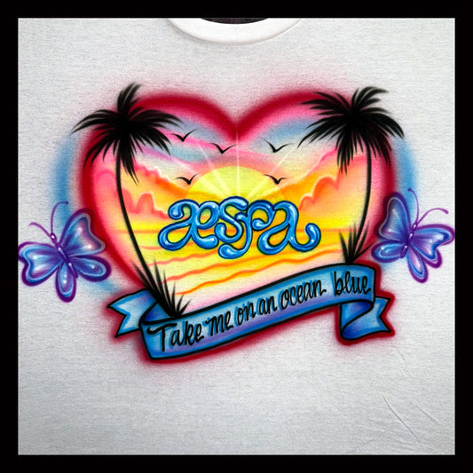 T-shirt with a colorful design featuring palm trees, butterflies, and text on a white background