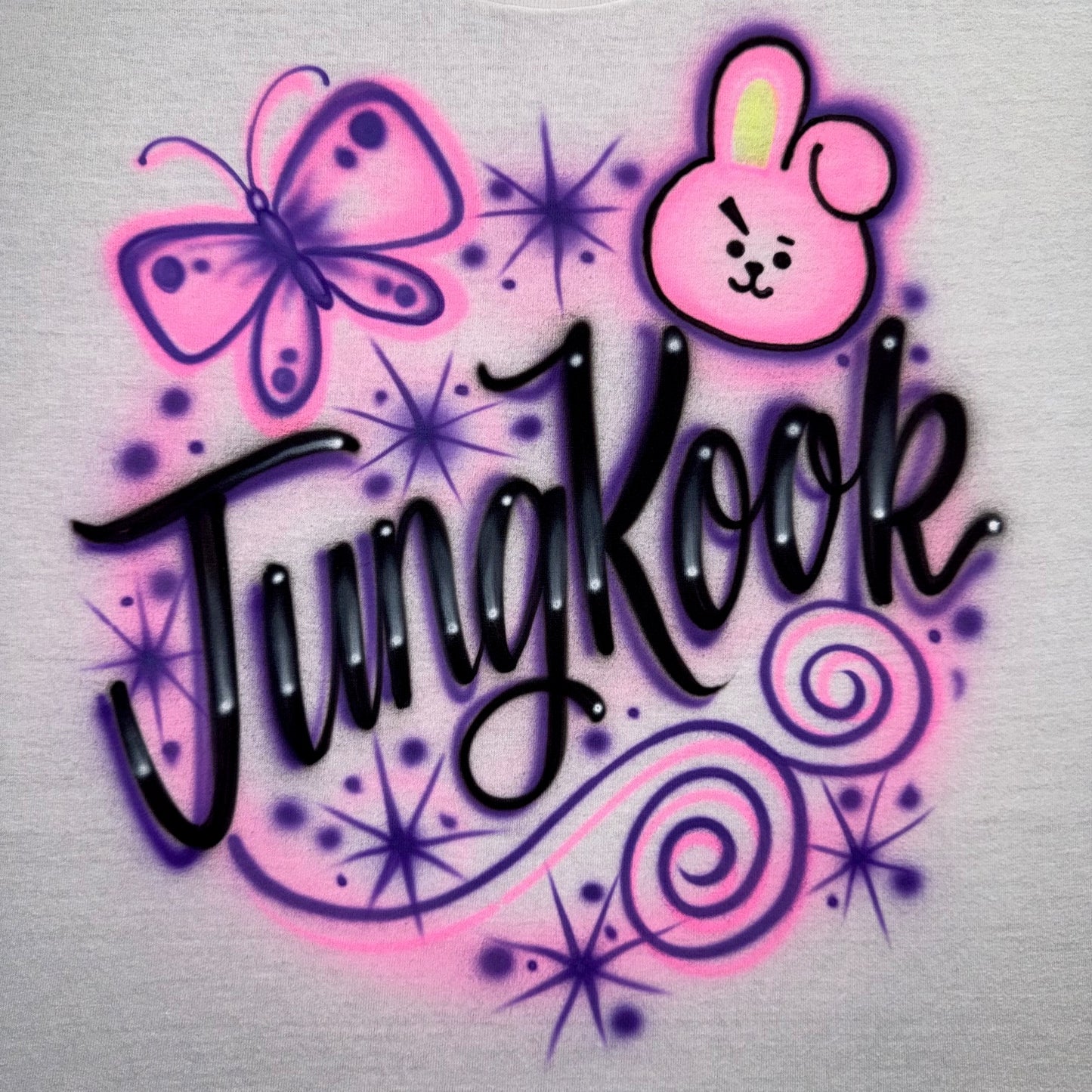 Decorative text with a pink bunny, butterfly, and star elements on a light gray background.