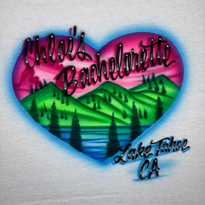 Heart-shaped mountains and lake and sunset airbrushed t-shirt