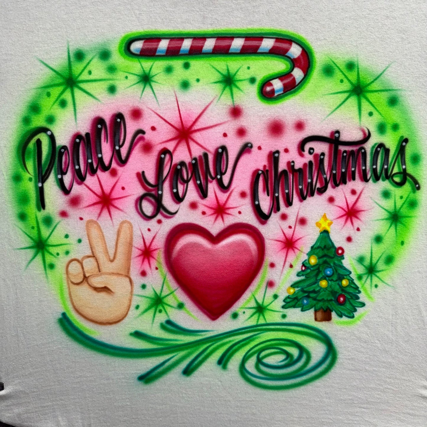 Airbrushed Peace Love Christmas design with peace sign hand, heart, Christmas tree, and candy cane in pink and green holiday colors.