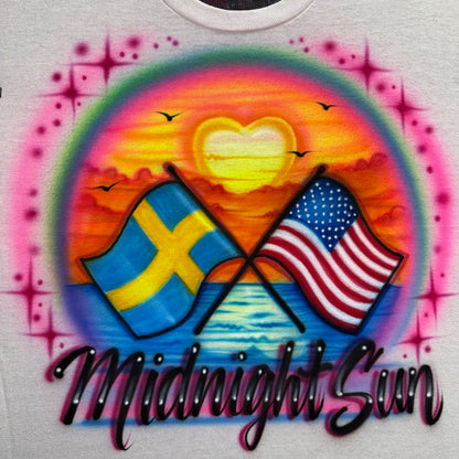 Hand airbrushed Midnight Sun design with Swedish and USA flags and a glowing heart sunset over ocean water.