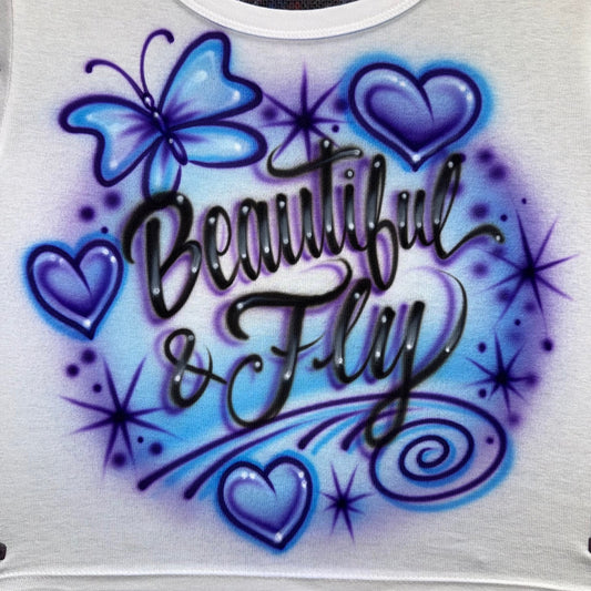 Beautiful & Fly airbrushed shirt with butterfly, hearts, sparkles, and custom script text in a hand-painted airbrush style