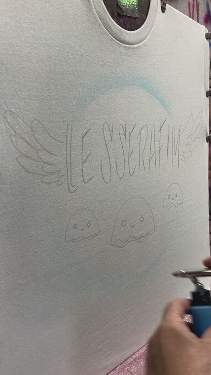 Le Sserafim scratch letters airbrush tee with angel wings and jellyfish