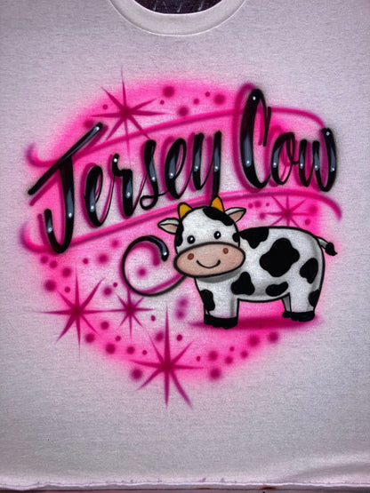 Airbrush T-shirt with a cute cow, starbursts in hot pink and fuchsia and the words "Jersey Cow"