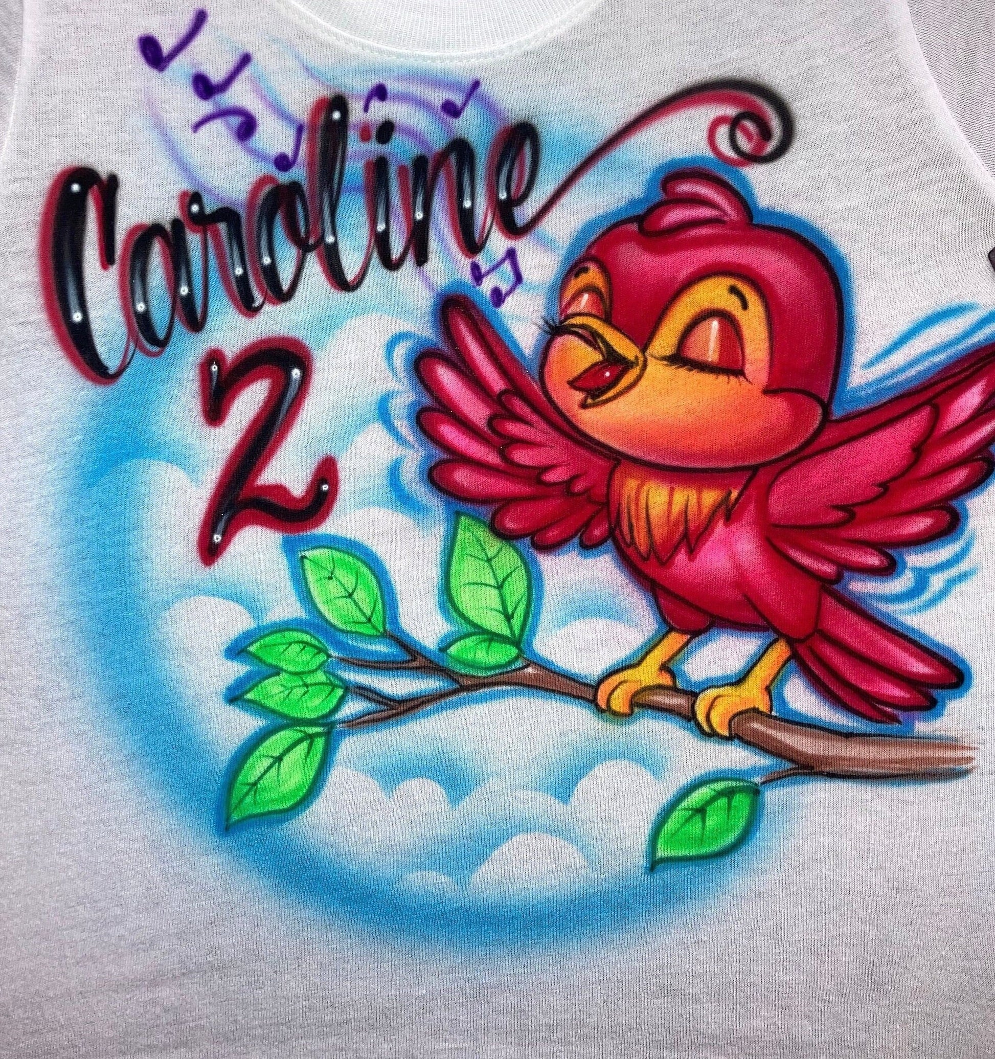 Airbrush T-shirt  with a  cute singing bird on a branch.  Includes a name and the number 2